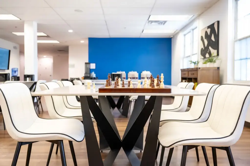 Activity room at Shore Point Recovery Center with modern seating and chessboard on table