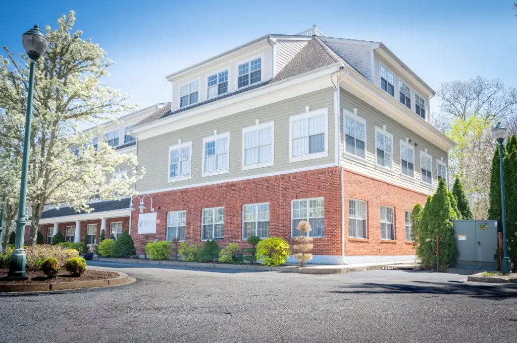 Exterior view of Shore Point Recovery Center building with landscaped entrance in Boston
