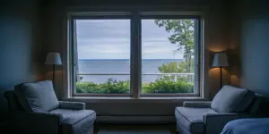 Peaceful luxury rehab room with soft lighting and ocean view