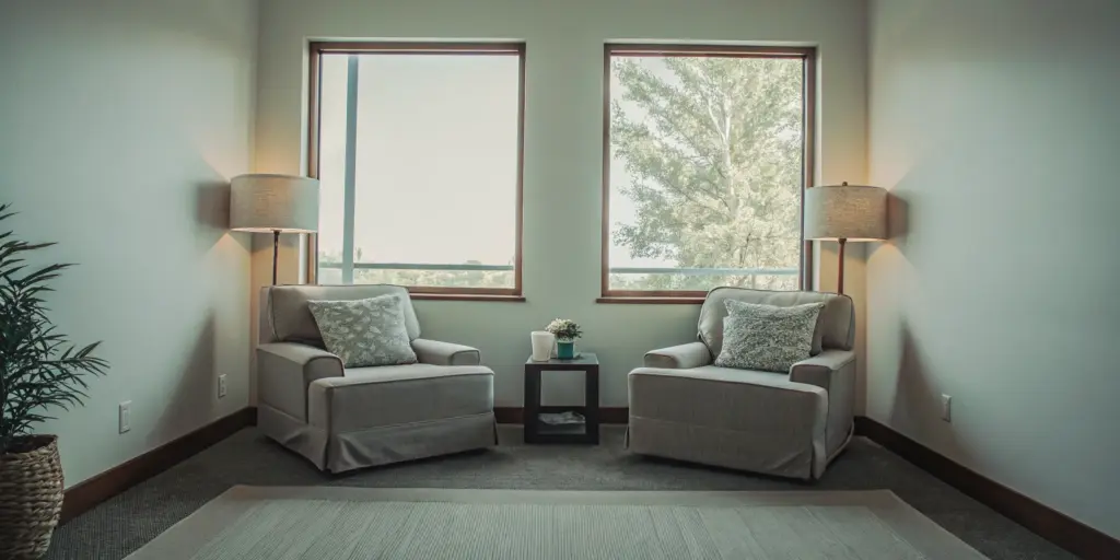 Peaceful coastal therapy room at Shore Point Recovery near Boston with natural light and serene water views